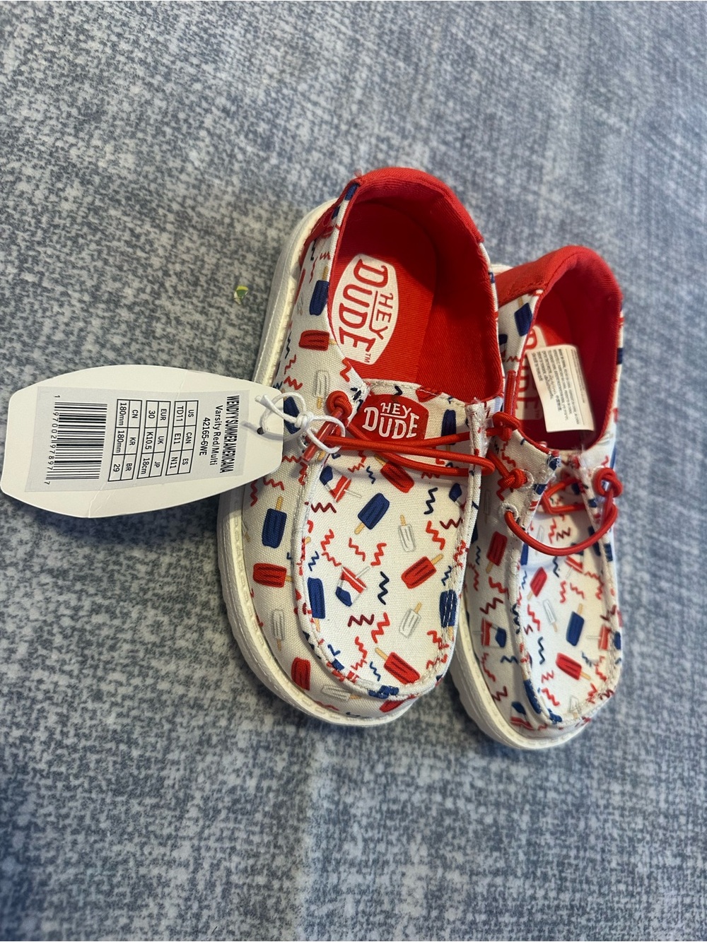 Hey Dude Kids White Shoes with Red and Blue Patterned Trim